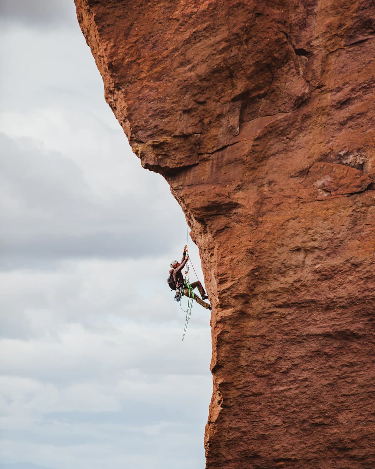 Climber using strength and mobility outdoors